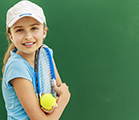 Girls holding tennis racket and ball